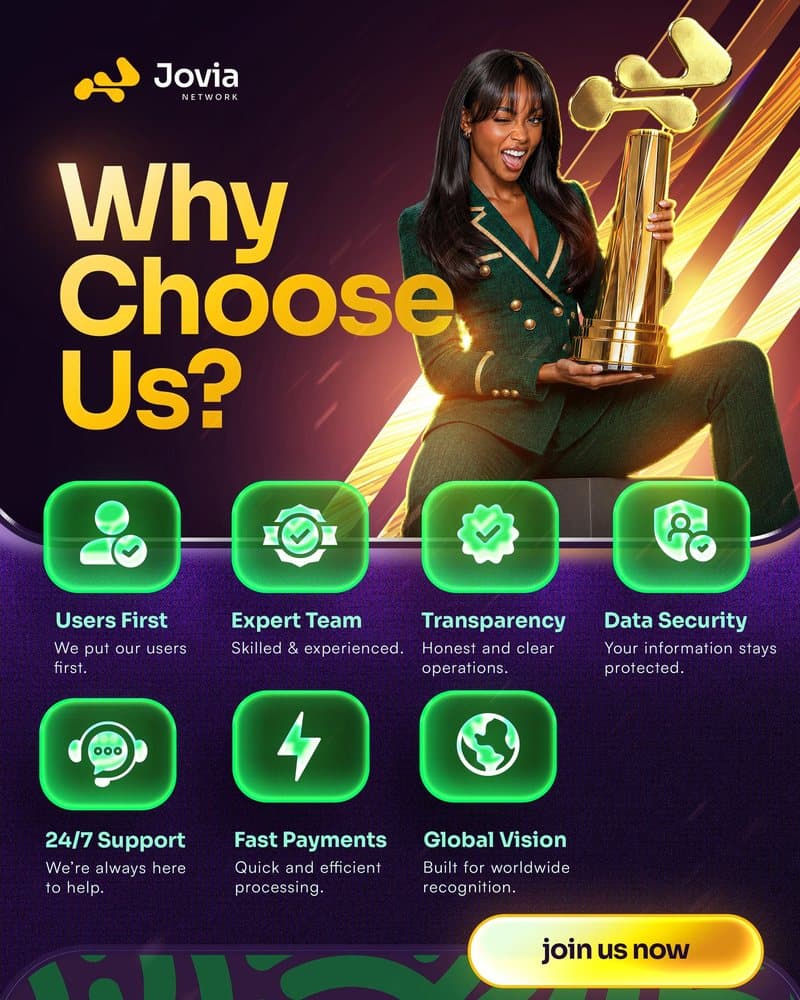 Jovia member holding a gold trophy shaped like the Jovia logo